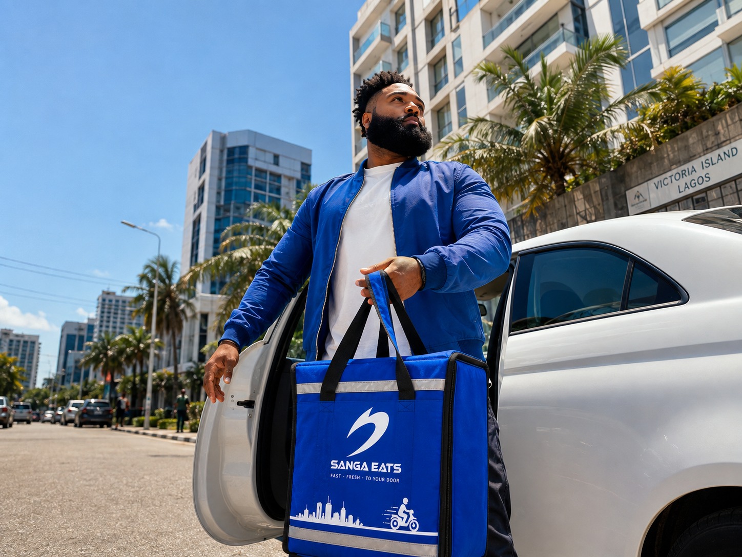 A Sanga Eats courier with a delivery bag in Victoria Island, Lagos